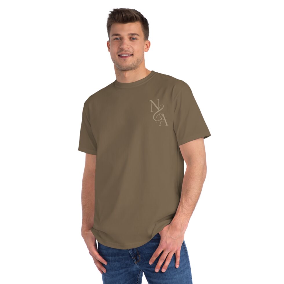 A photo of a male white model wearing a meteorite color tee shirt with a gold design NA tee shirt design.