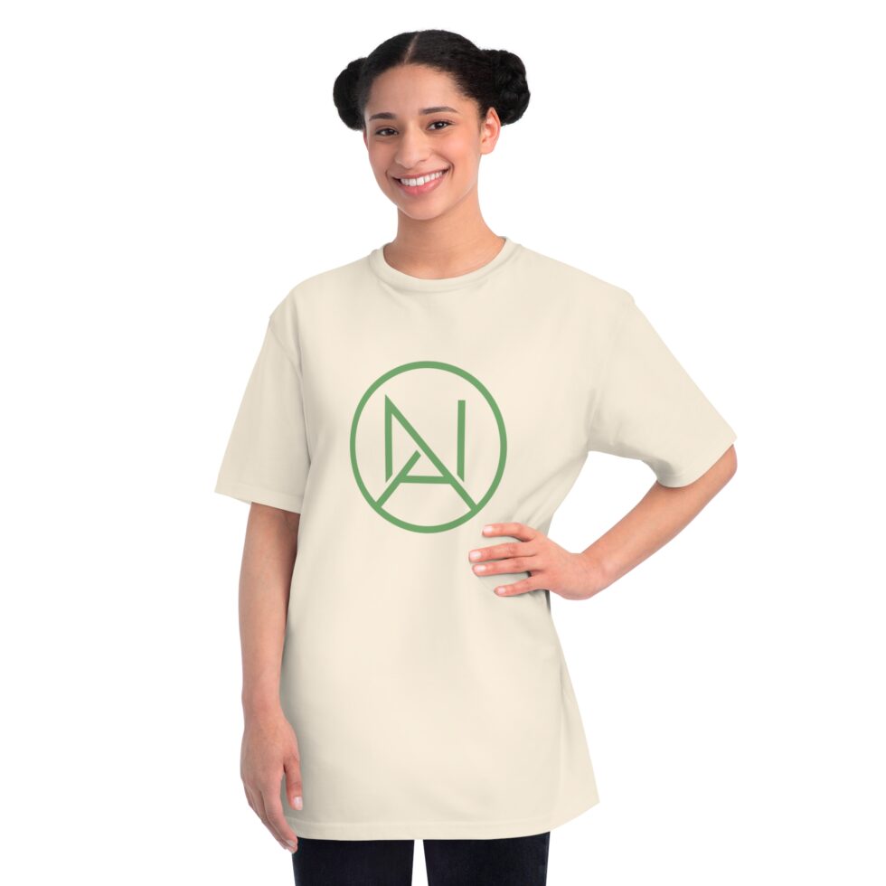 A photo of a female latin model wearing a natural color tee shirt with a green minimalist NA tee shirt design.