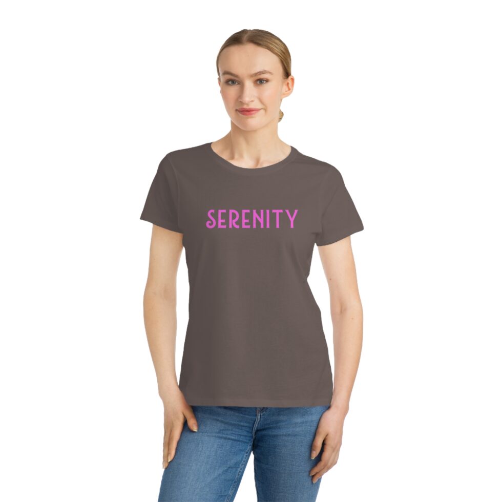 photo of a Young female natural model wearing a walnut color unisex tee shirt with a grey minimalist grey graphic NA tee shirt design.