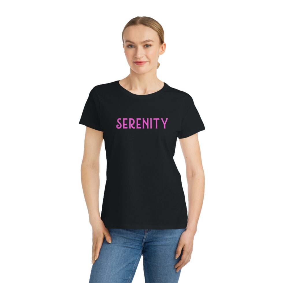 A photo of a young female model wearing a black color tee shirt with a serenity graphic NA tee shirt design.