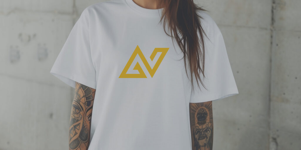 Young woman wearing a white NA tee shirt with tattoos.