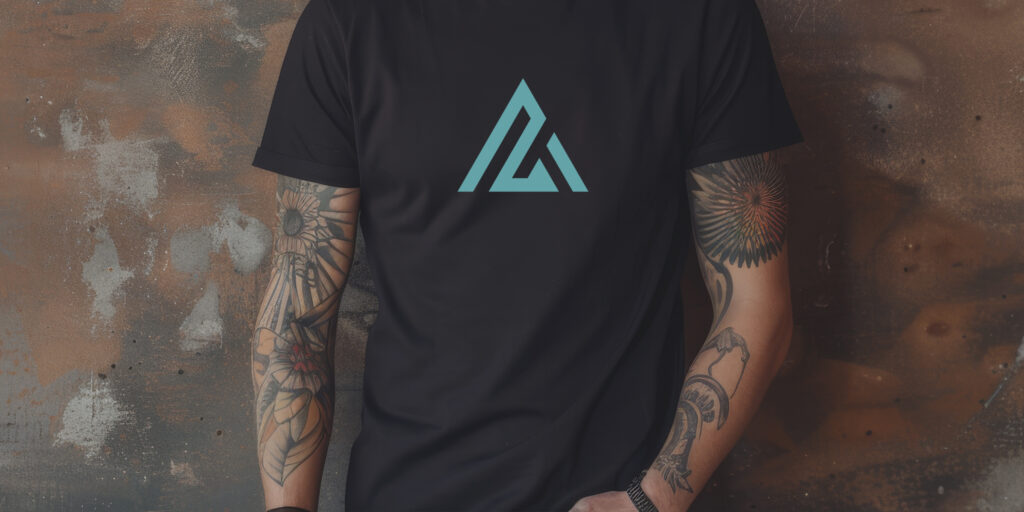 Cropped photo of a young man wearing a black NA tee shirt with a minimal light blue design.
