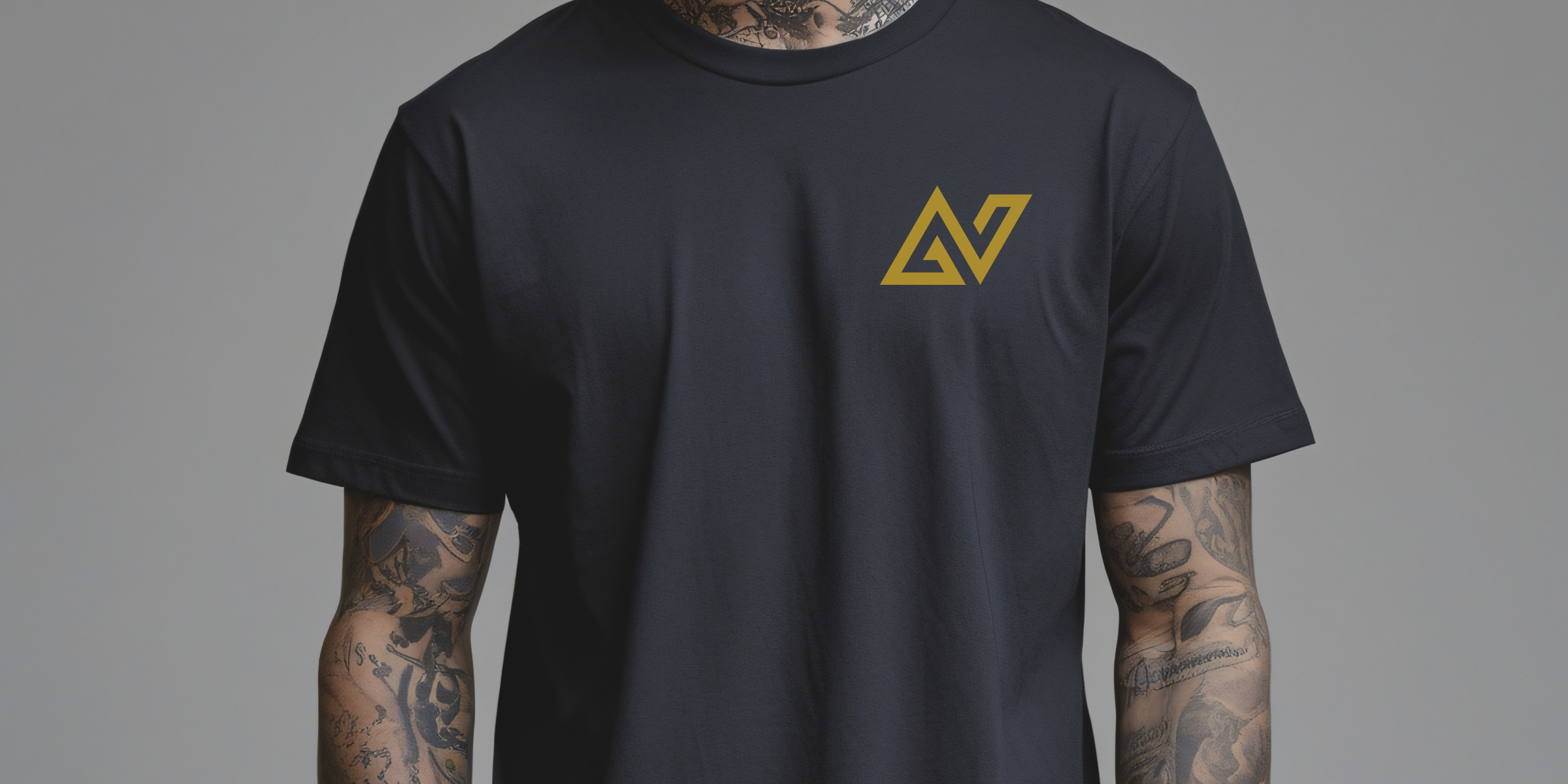 Young man with tattoos wearing a black minimalist NA t-shirt.