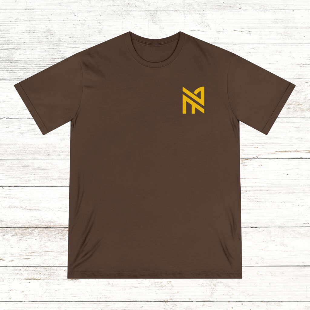Photo of the front and back of a walnut color NA tee shirt on a old white wood floor background
