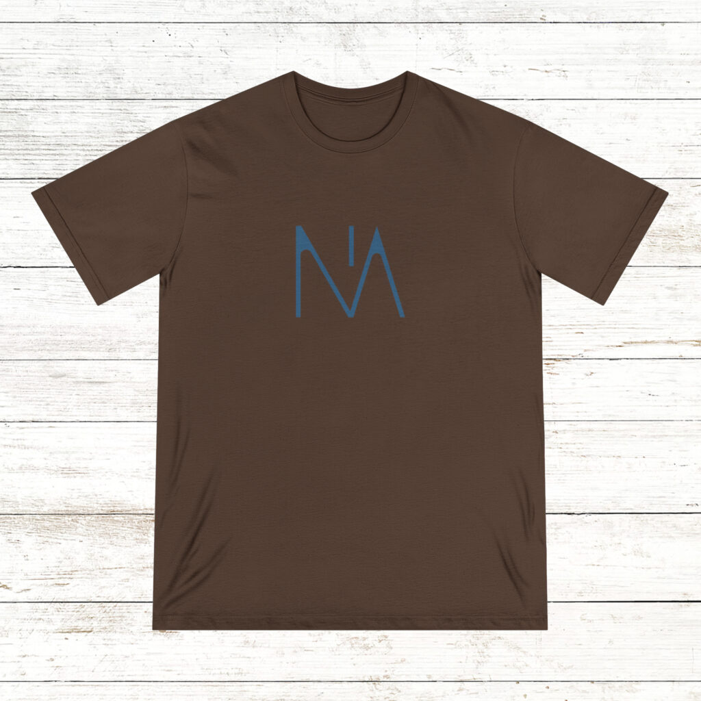 Photo of the front and back of a walnut color NA tee shirt on a old white wood floor background